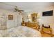 Cozy bedroom with hardwood floors and a decorative ceiling fan; perfect for relaxation and comfort at 101 N Riverside Dr # 214, New Smyrna Beach, FL 32169