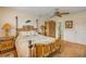 Relaxing bedroom featuring hardwood floors, a wooden bed frame, and a ceiling fan at 101 N Riverside Dr # 214, New Smyrna Beach, FL 32169