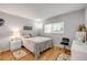 Well-lit bedroom featuring hardwood floors and a calming color palette, promoting a relaxing atmosphere at 101 N Riverside Dr # 214, New Smyrna Beach, FL 32169
