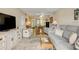 Spacious living area with glimpses of the dining area and a television at 101 N Riverside Dr # 214, New Smyrna Beach, FL 32169