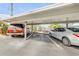 Assigned covered parking space with reserved signage, providing convenient and protected parking at 101 N Riverside Dr # 214, New Smyrna Beach, FL 32169