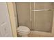 Bathroom featuring a toilet and glass-enclosed shower at 108 Lake Fairgreen Cir, New Smyrna Beach, FL 32168