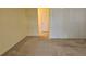 A comfortable bedroom features neutral carpet, a closet, and a doorway leading to another room at 108 Lake Fairgreen Cir, New Smyrna Beach, FL 32168
