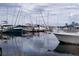 Boat dock with sailboats and motorboats on the water at 108 Lake Fairgreen Cir, New Smyrna Beach, FL 32168