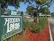 Hidden Lakes Golf Course sign with the community name and welcome message at 108 Lake Fairgreen Cir, New Smyrna Beach, FL 32168