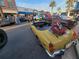 Vintage yellow convertible parked on a sunny street at 108 Lake Fairgreen Cir, New Smyrna Beach, FL 32168