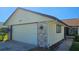 Charming home featuring an attached garage, stone accents, and well-manicured landscaping at 108 Lake Fairgreen Cir, New Smyrna Beach, FL 32168