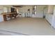 Spacious garage featuring epoxy flooring, laundry hookups, water heater and built in work bench at 108 Lake Fairgreen Cir, New Smyrna Beach, FL 32168