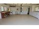 Spacious garage featuring epoxy flooring, laundry hookups, water heater and built in work bench at 108 Lake Fairgreen Cir, New Smyrna Beach, FL 32168