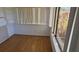 Sunroom area with wood floors at 108 Lake Fairgreen Cir, New Smyrna Beach, FL 32168