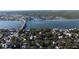 Scenic aerial view of the home and surrounding neighborhood, highlighting the Halifax river in the background at 111 Esther St, New Smyrna Beach, FL 32169