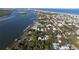 Aerial view showcasing the home's proximity to the water and nearby coastal community at 111 Esther St, New Smyrna Beach, FL 32169