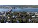 Expansive aerial view of the property surrounded by trees, showcasing its close proximity to the waterways at 111 Esther St, New Smyrna Beach, FL 32169