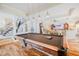 Recreational room with a pool table, open to a living area and staircase at 111 Esther St, New Smyrna Beach, FL 32169