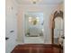 Charming bathroom featuring a vanity, chandelier, and elegant mirror for a relaxing retreat at 111 Esther St, New Smyrna Beach, FL 32169