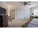 Bedroom with plush carpeting, closets, and an attached workspace at 111 Esther St, New Smyrna Beach, FL 32169
