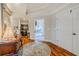 Elegant foyer showcasing hardwood floors, a decorative rug, and an inviting entryway at 111 Esther St, New Smyrna Beach, FL 32169