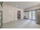 Spacious two-car garage with white walls, doors to the outside, storage shelves, and ample space for parking at 111 Esther St, New Smyrna Beach, FL 32169
