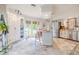 The spacious kitchen features an island with seating, stainless steel appliances, and abundant natural light from surrounding windows at 111 Esther St, New Smyrna Beach, FL 32169