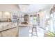 Bright kitchen features a central island with breakfast bar and modern appliances at 111 Esther St, New Smyrna Beach, FL 32169
