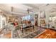 Open-concept living room with hardwood floors, comfortable seating, and elegant decor at 111 Esther St, New Smyrna Beach, FL 32169