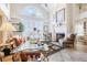 Elegant living room with high ceilings, fireplace, and plenty of natural light at 111 Esther St, New Smyrna Beach, FL 32169