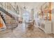 Open-concept space showcasing staircase, dining area, and elegant living room at 111 Esther St, New Smyrna Beach, FL 32169