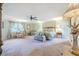 The main bedroom offers a serene retreat with soft lighting, comfortable furnishings, and a view of the outdoors at 111 Esther St, New Smyrna Beach, FL 32169