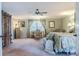 Relaxing bedroom featuring a sitting area by the window, traditional furnishings, and plenty of natural light at 111 Esther St, New Smyrna Beach, FL 32169