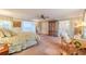 Bright main bedroom with a king bed, sitting area, and large closet offers plenty of room for relaxation and storage at 111 Esther St, New Smyrna Beach, FL 32169