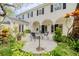 Picturesque patio area surrounded by lush greenery, providing a serene and private outdoor space at 111 Esther St, New Smyrna Beach, FL 32169