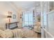 Cozy sitting room features neutral decor, shuttered windows, and plush seating at 111 Esther St, New Smyrna Beach, FL 32169