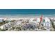 Aerial view of a beachside condo complex with pool, parking, and ocean views at 111 N Atlantic Ave # A219, New Smyrna Beach, FL 32169