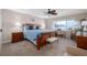 Bedroom featuring a beach view, ceiling fan, and desk area at 111 N Atlantic Ave # A219, New Smyrna Beach, FL 32169