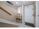 Entryway with a table and decorative items and stairwell leading to the second story at 111 N Atlantic Ave # A219, New Smyrna Beach, FL 32169