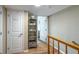 Hallway view with wood floors, Owner's Closet and open doorway to living area at 111 N Atlantic Ave # A219, New Smyrna Beach, FL 32169