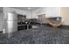 Kitchen with stainless steel appliances and a dark stone countertop at 111 N Atlantic Ave # A219, New Smyrna Beach, FL 32169