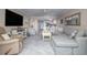 Open-concept living space with kitchen, dining, and views to the water at 111 N Atlantic Ave # A219, New Smyrna Beach, FL 32169
