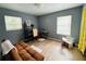 Cozy bedroom with hardwood floors, dual windows, and plenty of natural light at 1136 Elizabeth St, New Smyrna Beach, FL 32168