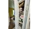 A view into a linen closet stocked with blankets, sheets, and towels at 1136 Elizabeth St, New Smyrna Beach, FL 32168