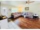 Comfortable living room with hardwood floors, sectional sofa and plenty of light at 1136 Elizabeth St, New Smyrna Beach, FL 32168