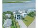 Breathtaking aerial view of a waterfront property, nestled among mature trees at 1194 N Peninsula, New Smyrna Beach, FL 32169