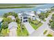 Gorgeous waterfront home with an elegant exterior, lush landscaping, and spacious driveway at 1194 N Peninsula, New Smyrna Beach, FL 32169