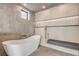Spa-like bathroom showcasing a modern soaking tub and a shower with sleek fixtures at 1194 N Peninsula, New Smyrna Beach, FL 32169