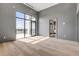 Open bedroom showcases large windows with natural light and an en-suite bathroom at 1194 N Peninsula, New Smyrna Beach, FL 32169