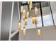 Stylish, gold-toned chandelier hangs from the ceiling at 1194 N Peninsula, New Smyrna Beach, FL 32169