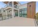 Gorgeous deck showcasing glass railings, wood accents, and seamless indoor-outdoor living at 1194 N Peninsula, New Smyrna Beach, FL 32169