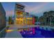 Stunning three-story home featuring a private pool, multiple balconies and modern architectural design at 1194 N Peninsula, New Smyrna Beach, FL 32169