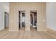 Hallway featuring laundry and bathroom entrances accentuated by unique wood accent wall at 1194 N Peninsula, New Smyrna Beach, FL 32169