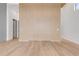 Bright room featuring modern wood accent wall with concealed lighting and light hardwood flooring at 1194 N Peninsula, New Smyrna Beach, FL 32169
